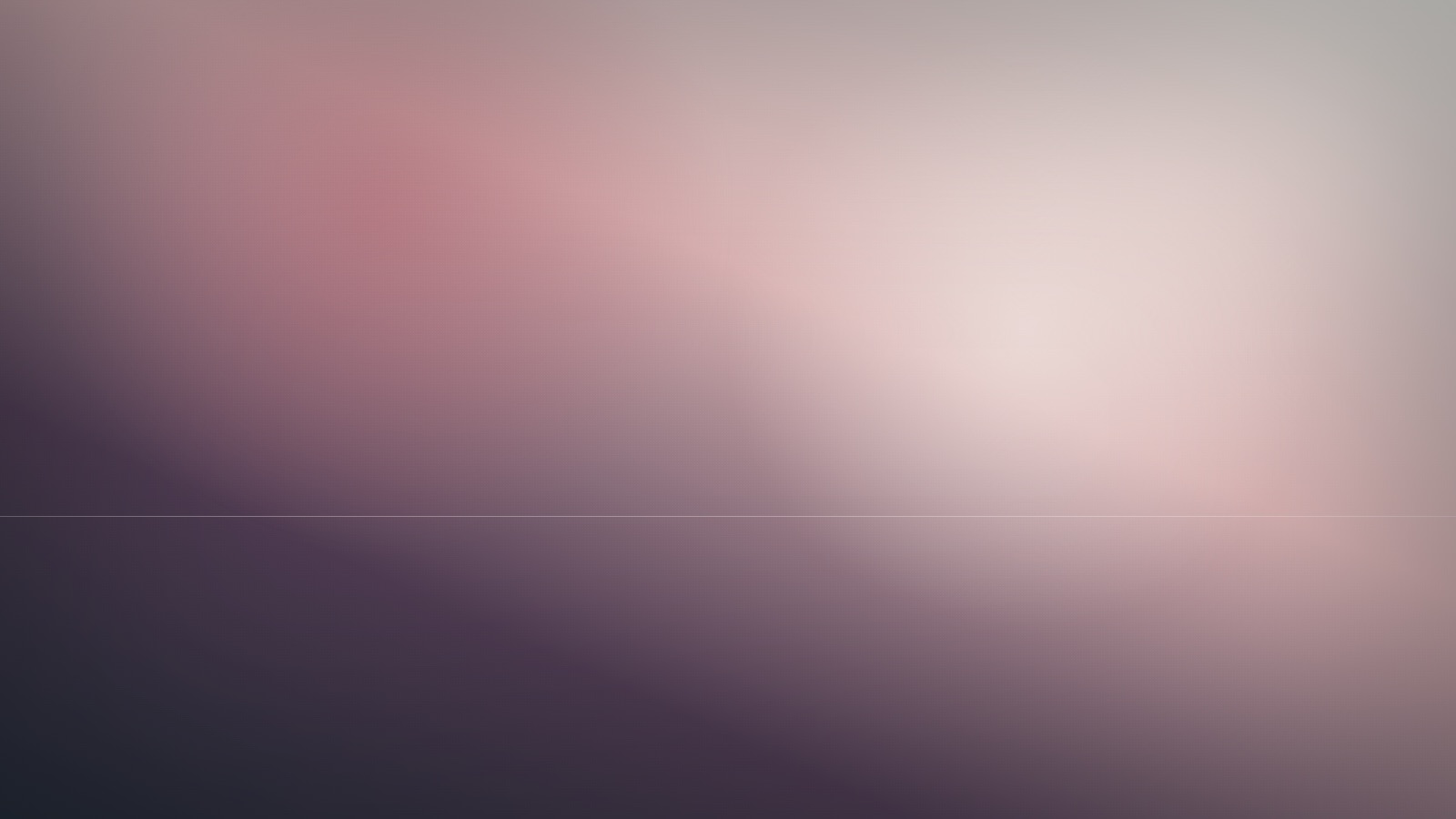 A broad expanse of soft, even colour beneath a still and quiet sky.